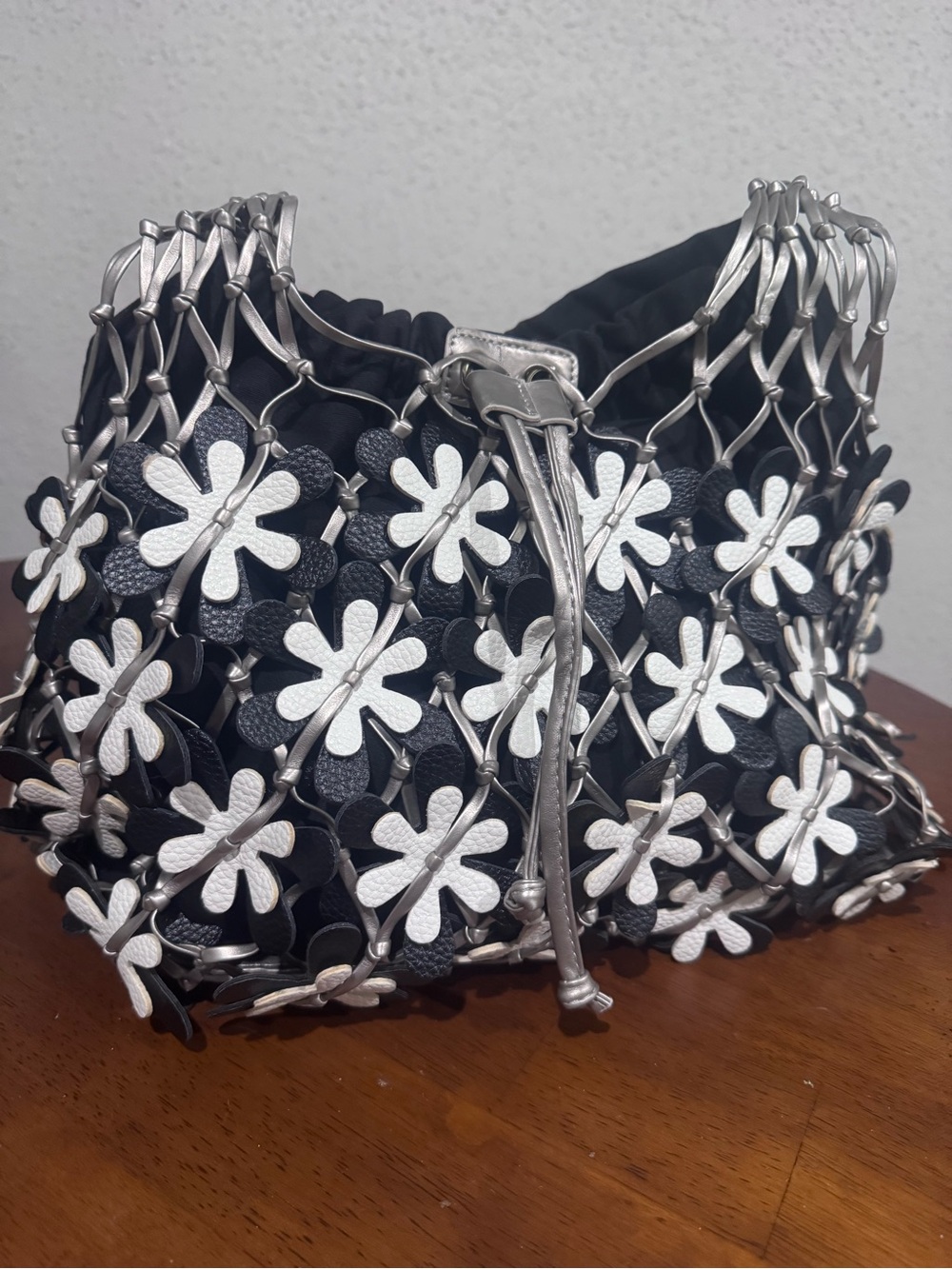 Black and Silver Floral Appliqué Drawstring Shoulder Bag